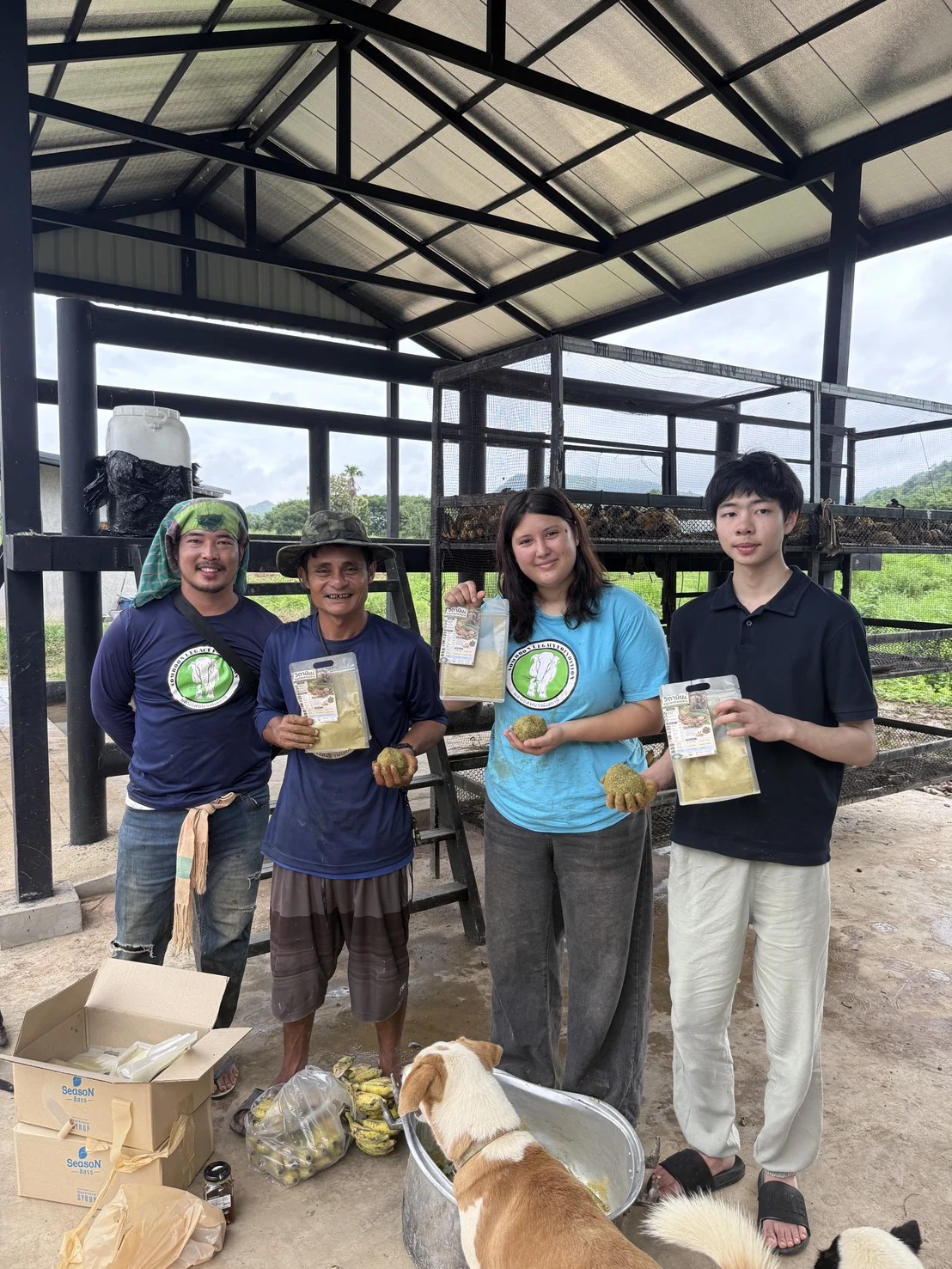 The project team holding supplement pouches at Somboon Legacy Foundation